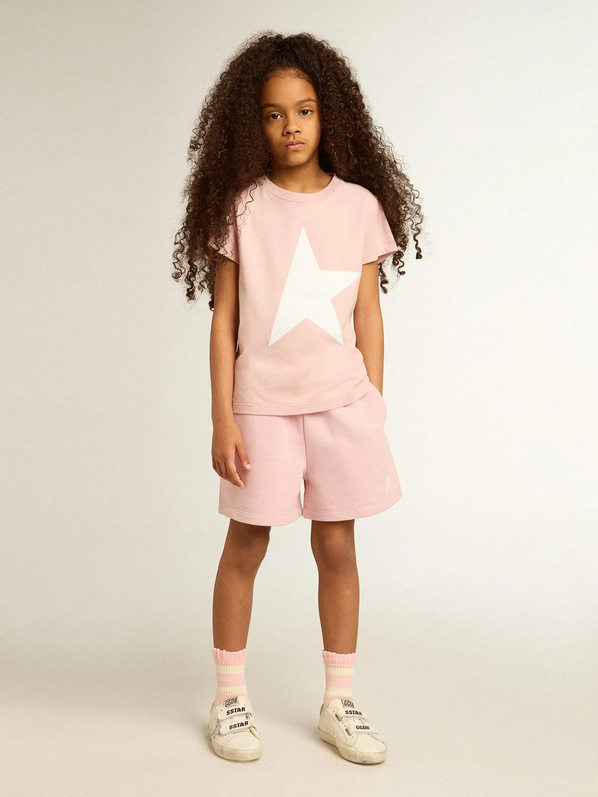 T-shirt rosa da bambina con logo e maxi stella di colore bianco