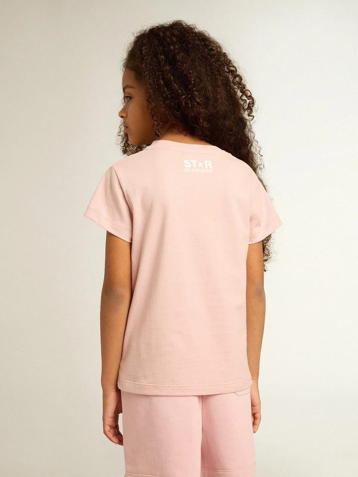 T-shirt rosa da bambina con logo e maxi stella di colore bianco